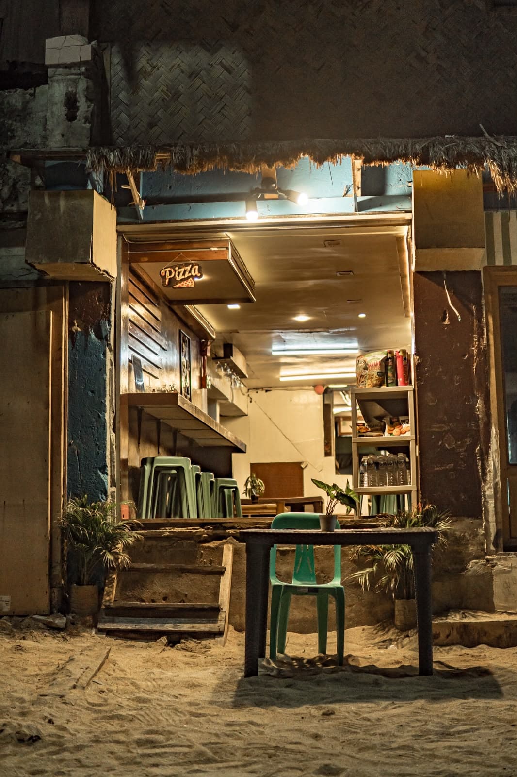 An empty table outside a night café